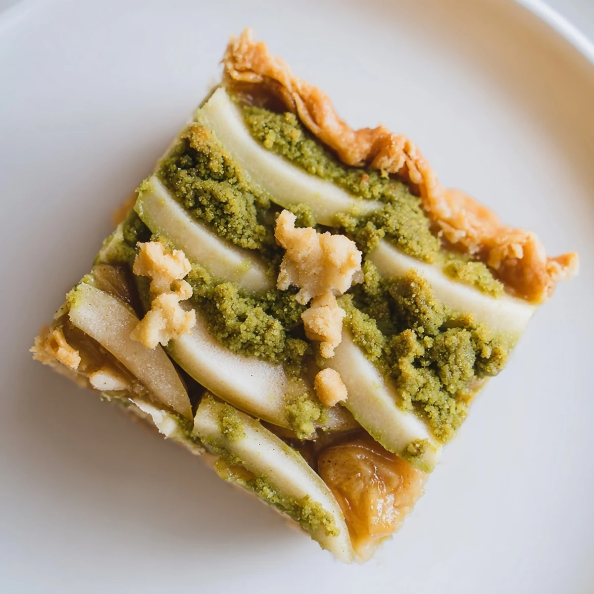 Delicious matcha caramel apple bars served warm with a scoop of vanilla ice cream.  