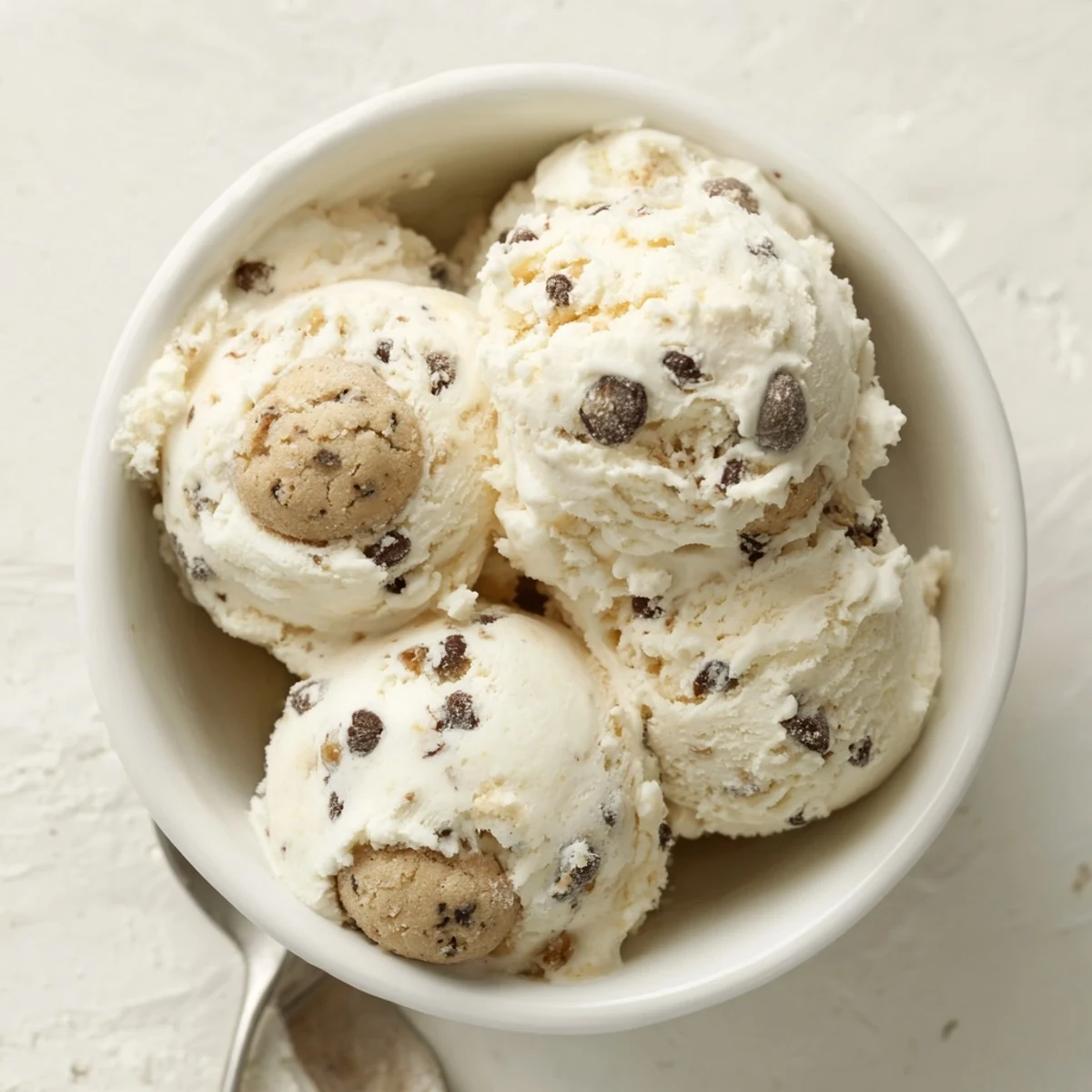 Creamy Cottage Cheese Ice Cream with Cookie Dough sprinkled on top, a delightful treat.  