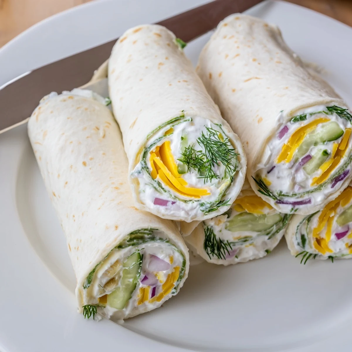 Crispy Pickle-in-a-Blanket snacks wrapped in cheese and tortillas for easy bites.  