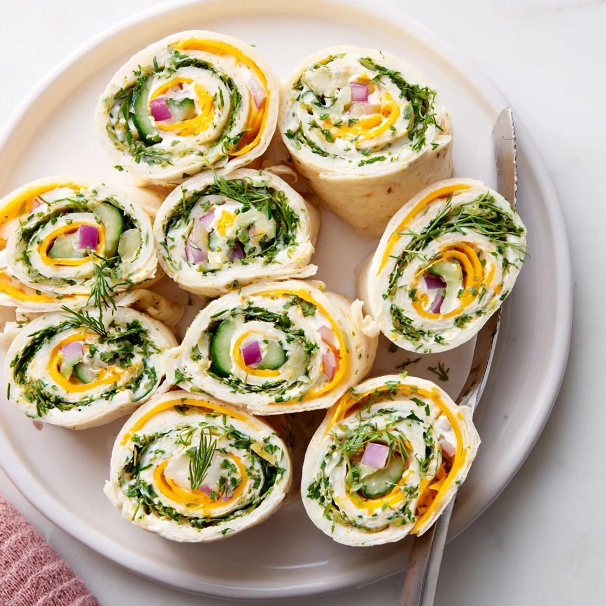 Tangy Pickle-in-a-Blanket appetizer featuring creamy cheese and fresh dill flavors.  