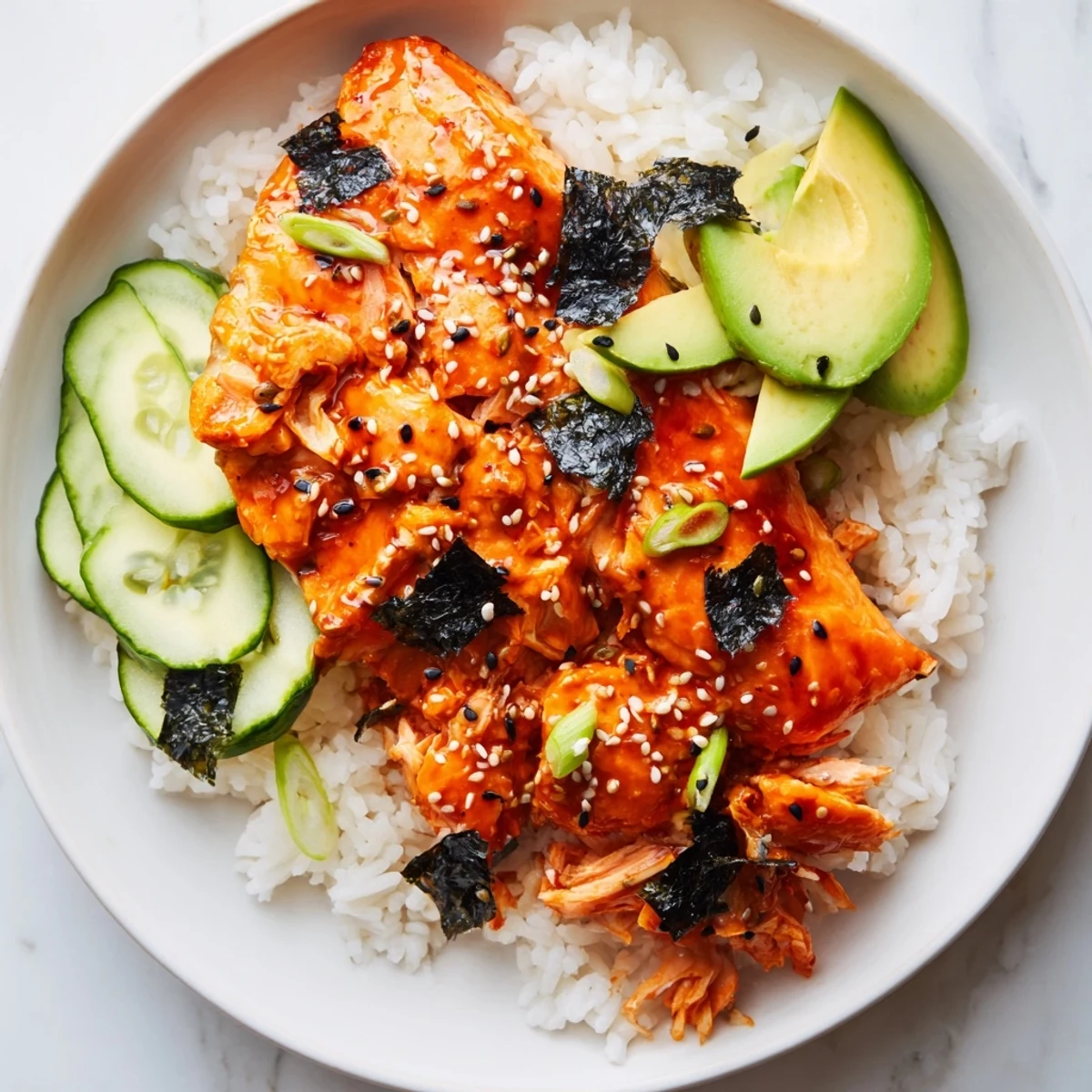 A photo showcases the Emily Mariko-inspired gochujang salmon bowl, a colorful blend of textures and flavors.
