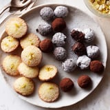 Golden-brown Lemon Madeleines and dark chocolate truffles, part of a Mignardises Bonne Année 2026 dessert spread.