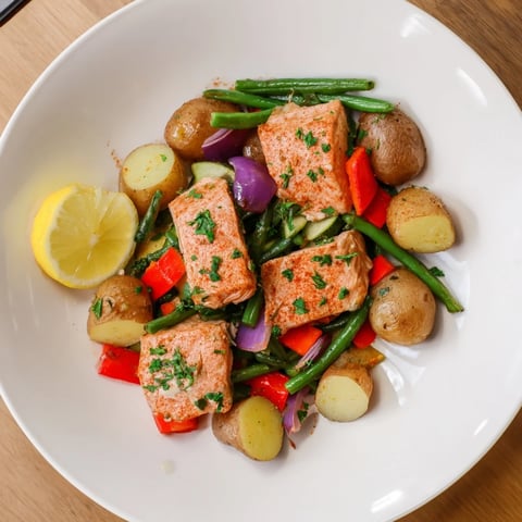Golden potatoes and flaky salmon, a flavorful Salmon & Potato Skillet with fresh parsley.