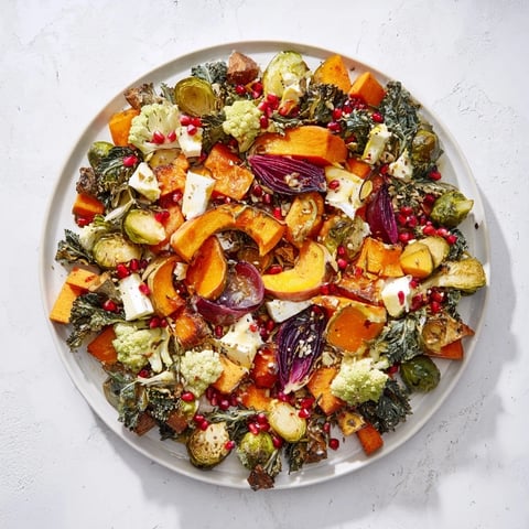 A colorful, roasted Festive Vegetable Christmas Wreath ready to serve, a flavorful holiday centerpiece.
