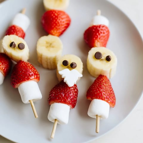 Vibrant Banana Strawberry Santa Skewers, a delicious visual of a festive fruit appetizer on a serving platter.