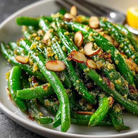 Garlic Green Bean Almondine: Fragrant dish of vibrant green beans with toasted almonds.