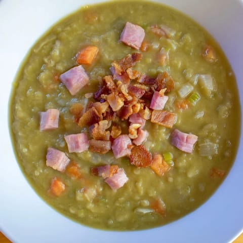 Close-up photo of savory Split Pea Soup with rich flavors from smoky bacon and canned ham.