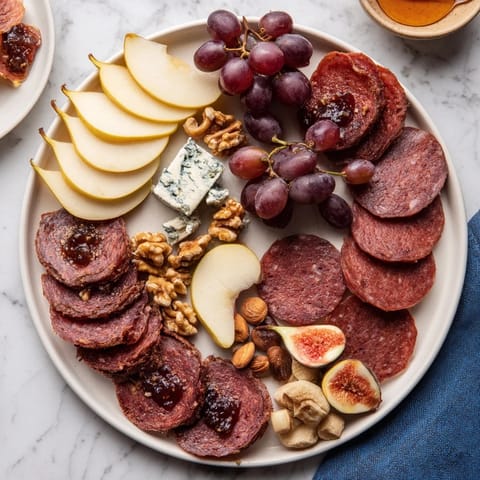 Tempting Majestic Venison Charcuterie Platter with a colorful array of fruits and tasty accompaniments.