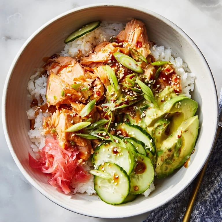 Quick, flavorful leftover salmon & rice bowl drizzled with soy sauce and sesame oil.  