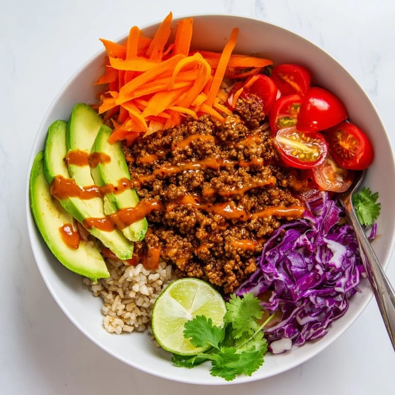 Satisfying plant-based meat bowl featuring quinoa, vibrant vegetables, and zesty flavor.
