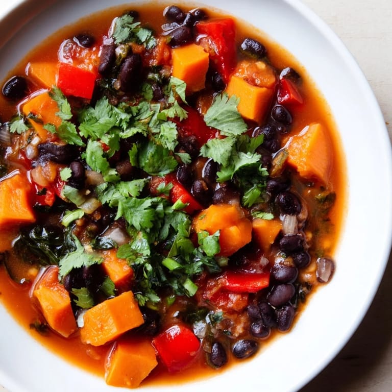 Close-up of a flavorful, vegetarian Sweet Potato & Black Bean Chili, perfect for a cozy dinner.