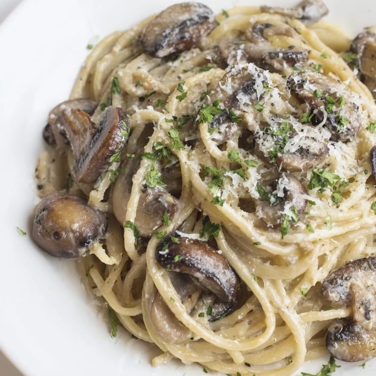 Golden, tempting Creamy Mushroom Linguine, perfectly coated in a creamy, flavorful sauce and ready to eat.